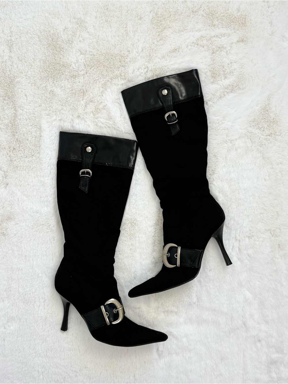 Mia black knee high pointed boots with silver buckle details